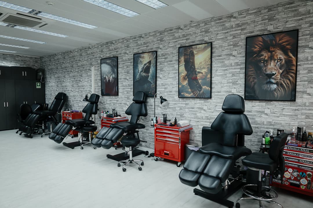 Tattoo stations along the white brick wall
